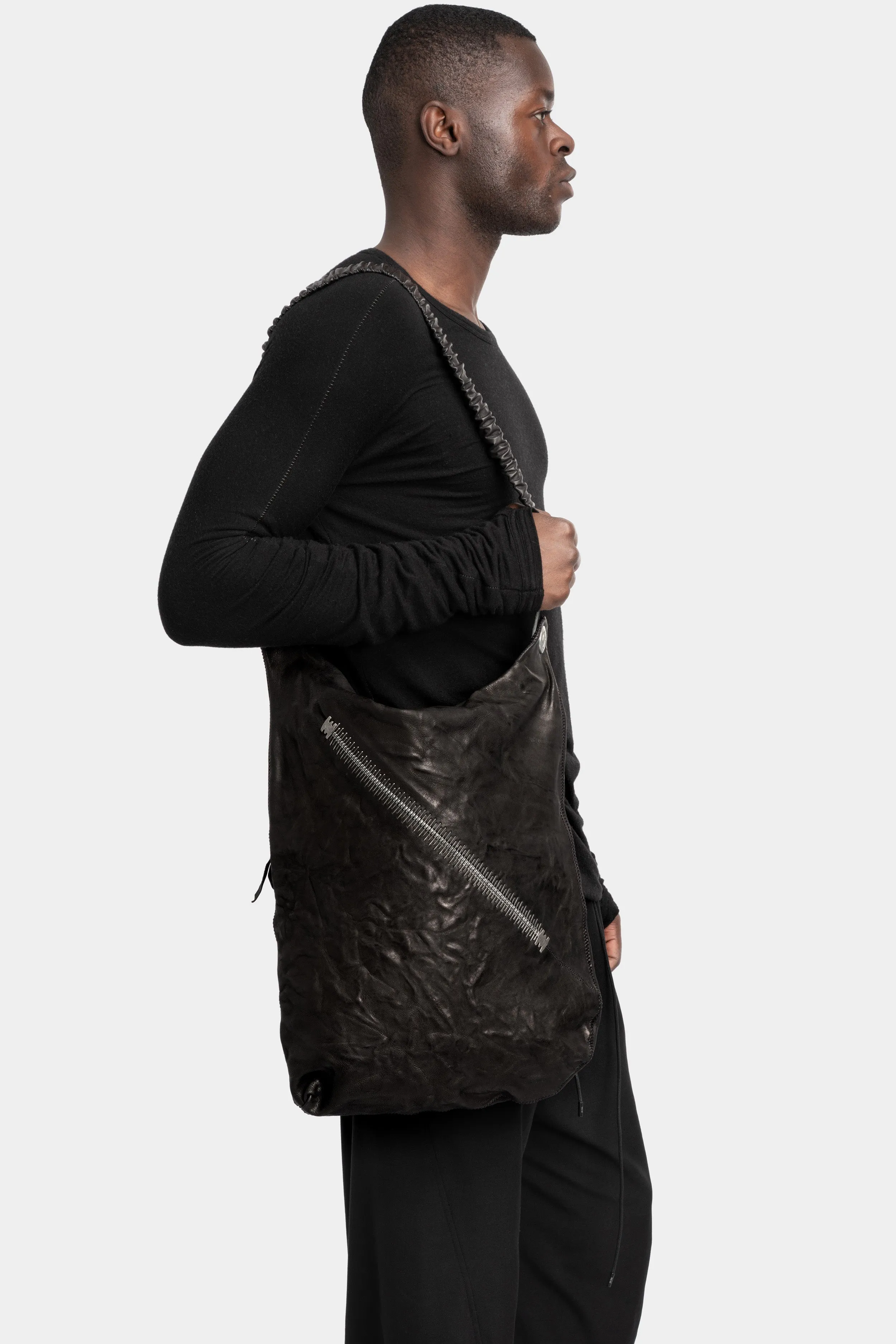 Large stapled crossbody leather bag