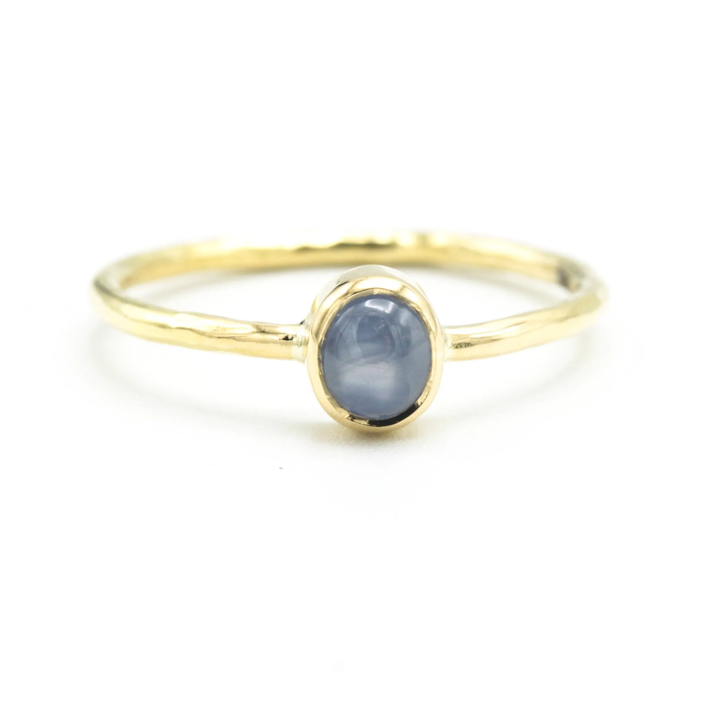 Oval Blue star sapphire in bezel settings with 18k gold texture band