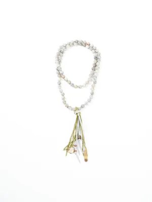 precious stone with leather and silk tassel
