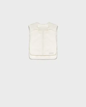 Reversible down-filled bib in matte and shiny water-repellent technical fabric